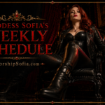 Goddess Sofia in black leather seated confidently on an ornate throne in a dark, luxurious room with crimson velvet curtains, candlelight, roses, and gold accents. The image reads “Goddess Sofia’s Weekly Schedule” with “WorshipSofia.com” beneath it.