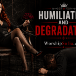 Humiliation and Degradation article banner featuring Goddess Sofia seated regally in a black leather chair beside a kneeling male submissive, surrounded by elegant black, crimson, and gold décor. The banner reads “Humiliation and Degradation” and “WorshipSofia.com.”
